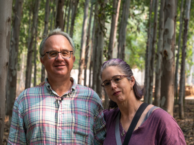 Rob and Shannon Dunbabin standing in outside at a mill in India.