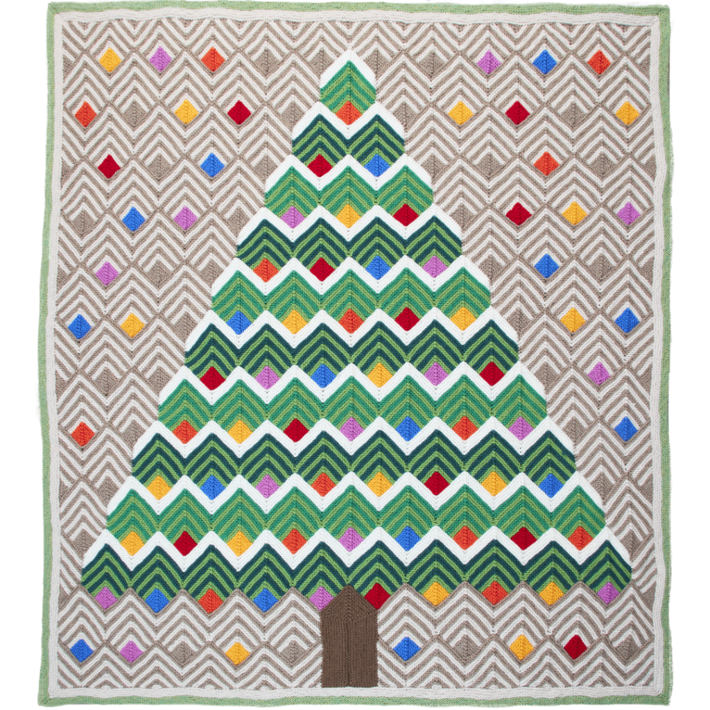 A knitted blanket featuring a lighted tree with various colors. The Tree of Light Blanket, is a design by Margaret Holzmann.
